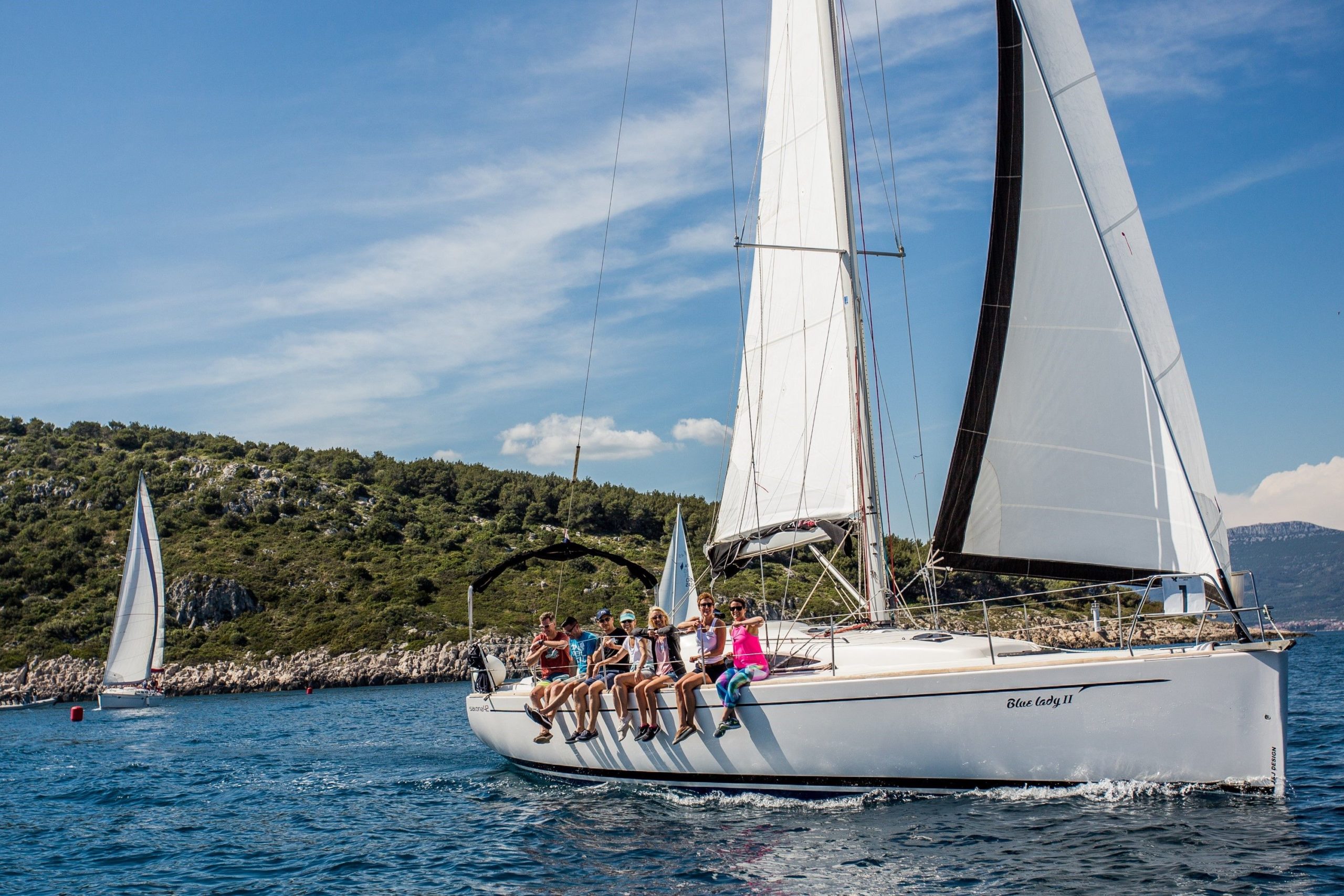 The best time to visit Croatia, sailing boat on the Adriatic sea and people enjoying on the deck